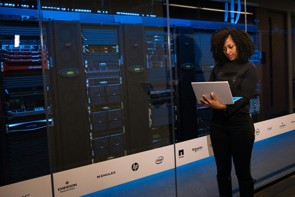 Engineer managing high-speed server room equipment